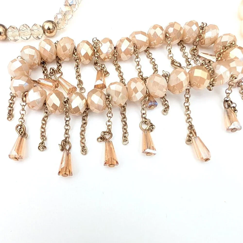 Bundle of nude and natural beaded stretch bracelets